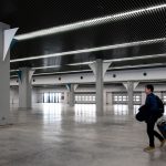 Traveller walking through a modern airport hall